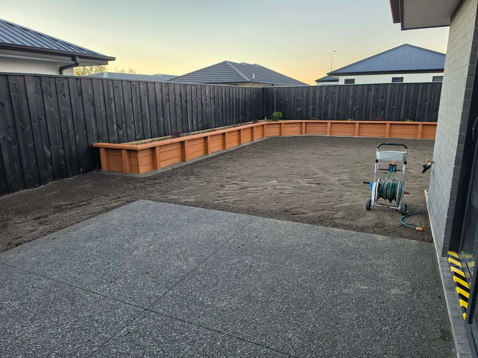Decorative stone border and planting along the property at 25 Derbridge Street, Christchurch