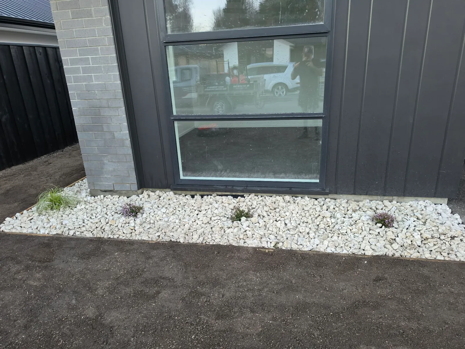 Garden areas with decorative stone and new planting at 25 Derbridge Street